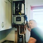 Anthony from DPH installing a boiler.